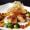 Seared Scallops with Golden Raisin Puree and Bacon Braised Brussels Sprouts